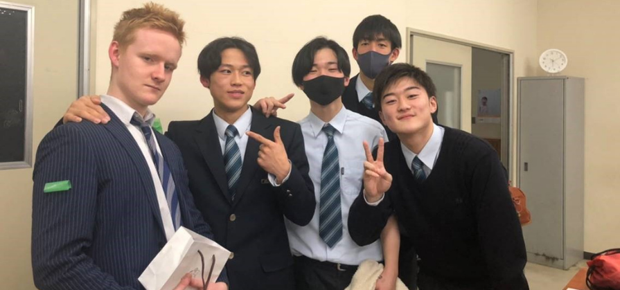 CCGS alumni Cameron Barnett with students in Japan