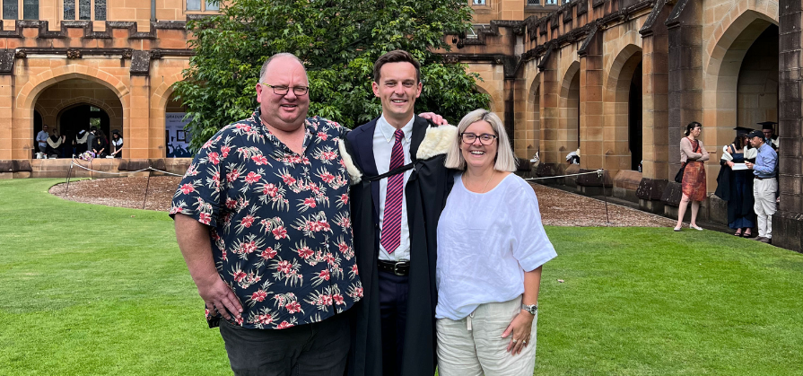 Chris Ball with his parents on graduation day
