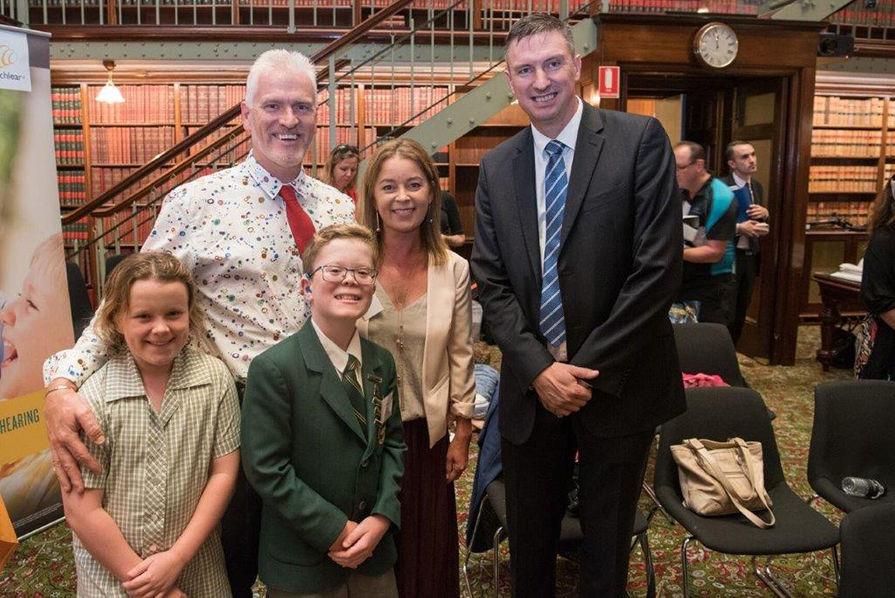 Eoin and his family with Minister Hazzard