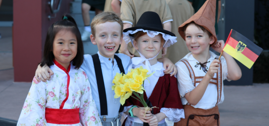 Children take part in an International Parade for Harmony Day 2022