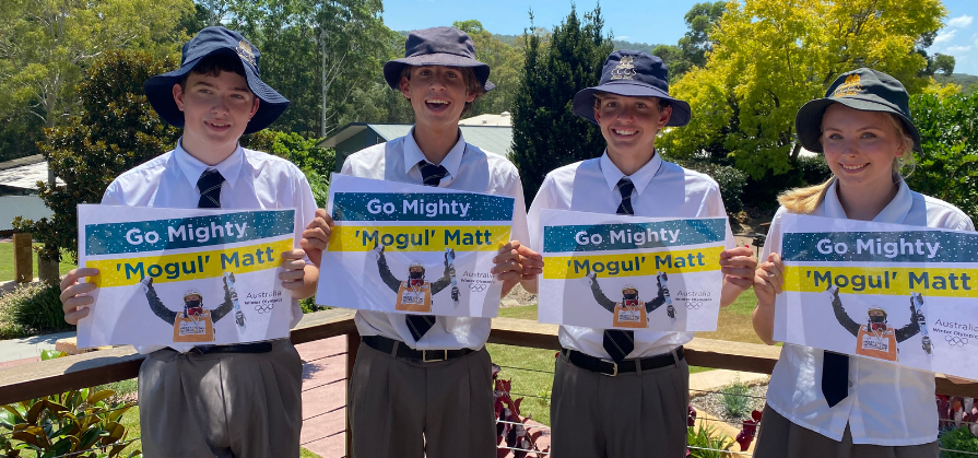 CCGS students proudly hold Go Mighty Matt posters