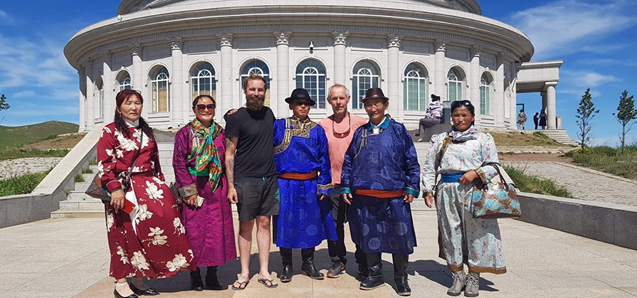Tourists-standing-with-Mongolians-in-national-dress