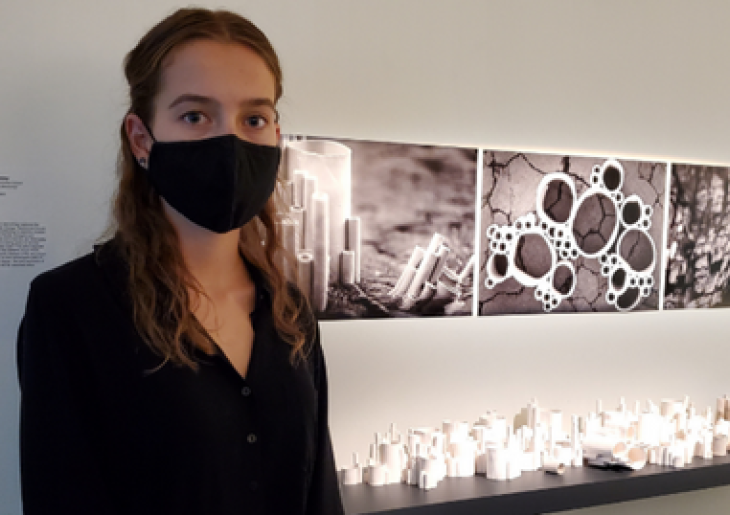 CCGS alumni Hannah Stanley with her exhibited artwork